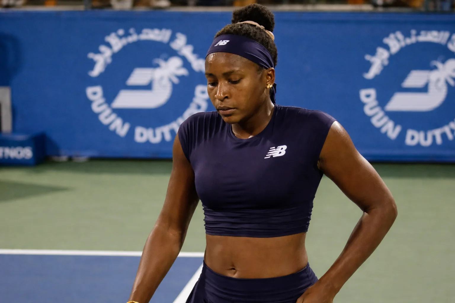 Coco Gauff stands composed on court at the Dubai Duty Free Tennis Championships, showing resilience and inner strength after a hard-fought match.