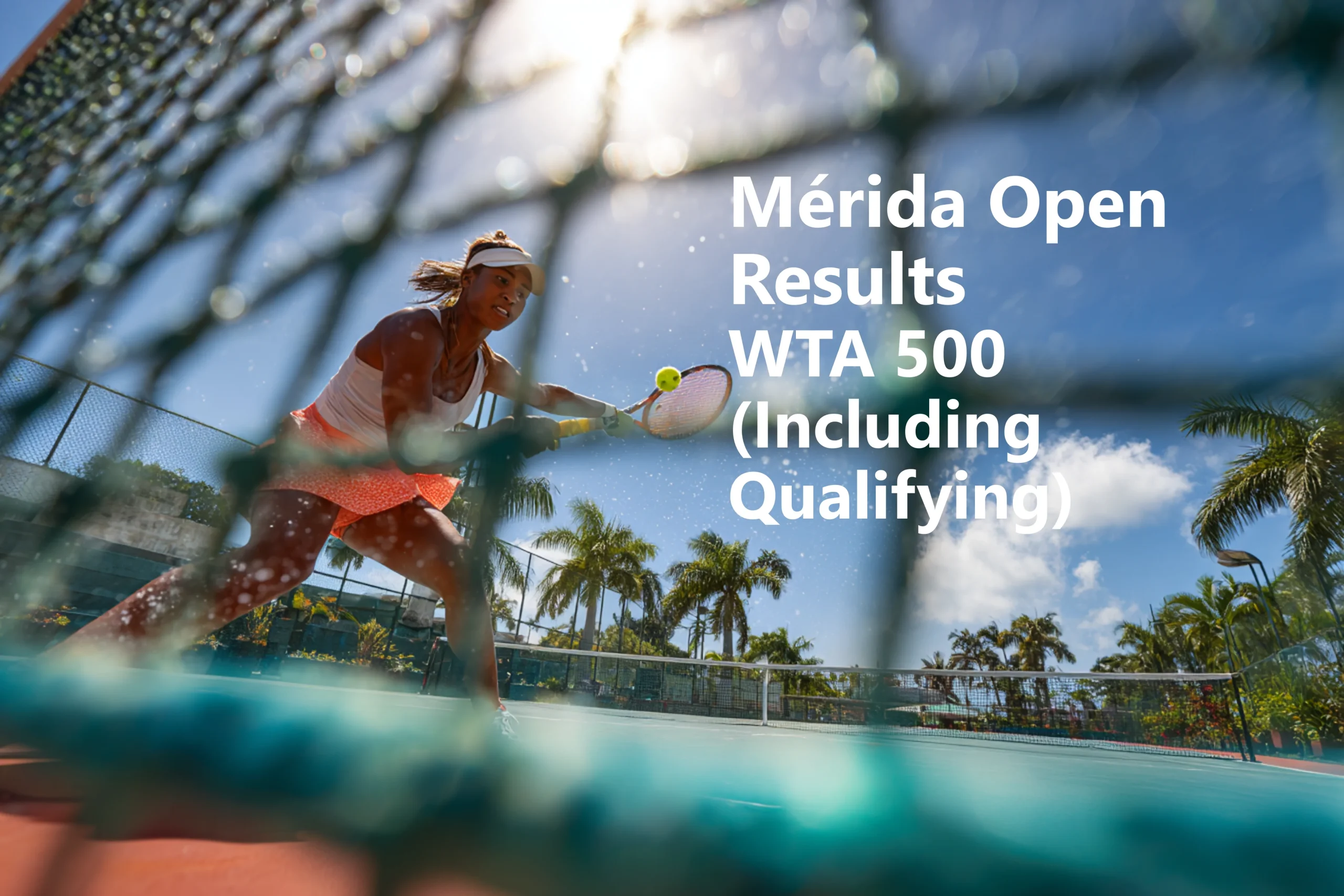 Professional female tennis player hitting a forehand at the Mérida Open WTA 500 tournament in Mexico, viewed through the net with palm trees and blue sky in the background.