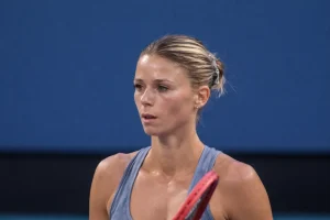Camila Giorgi focused during a match in Miami 2024, fueling speculation about a possible comeback from retirement in professional tennis.