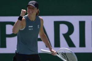 Iga Swiatek celebrates a point during the 2026 Sunshine Double on a hard court tennis match