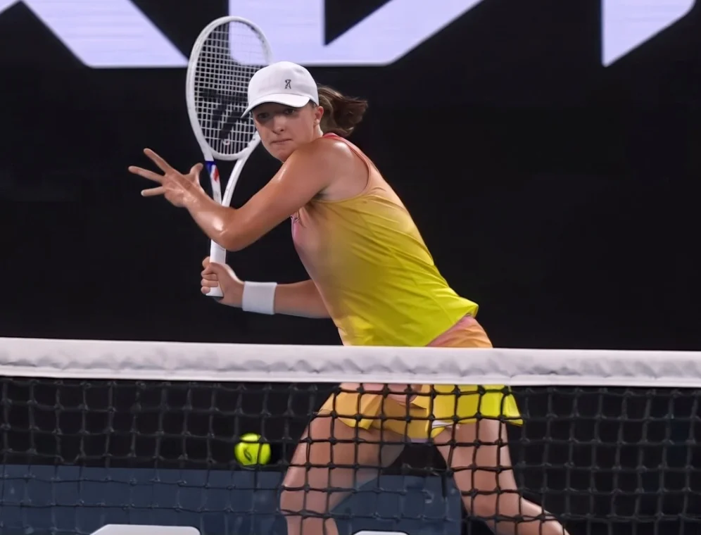 Iga Swiatek hitting a forehand during a match