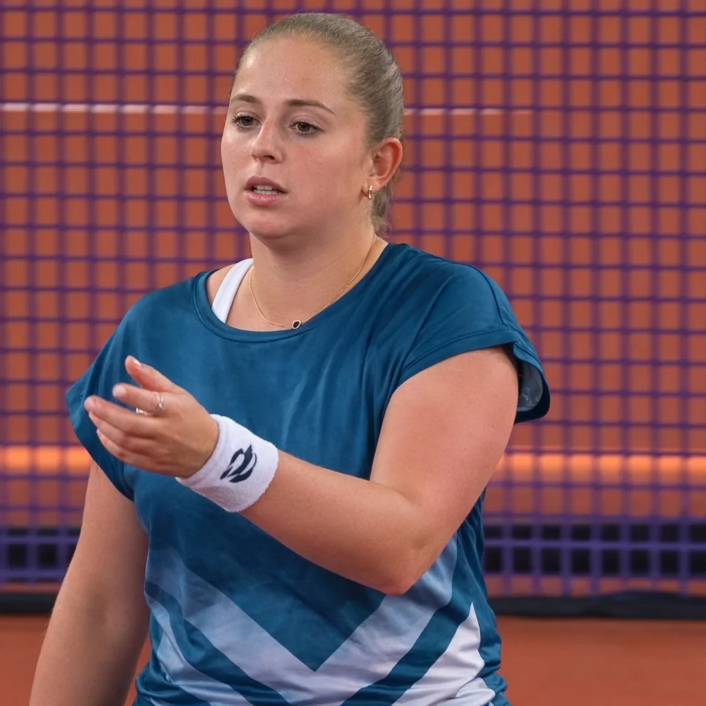 Jelena Ostapenko reacts during a match at the Linz 2026 tournament, gesturing on court with focus and intensity.