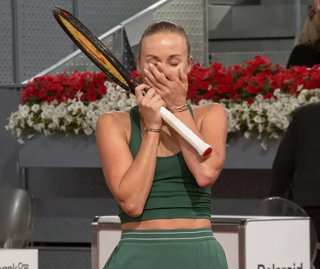 Anastasia Potapova celebrates after defeating Elena Rybakina in straight sets at the Madrid Open 2026. The Russian tennis star shows emotion during her victory moment on court.