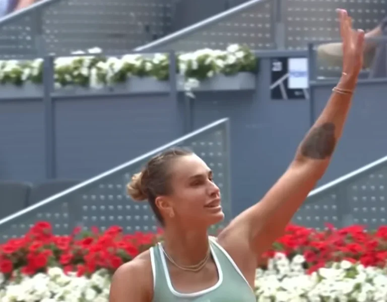 Aryna Sabalenka waves to the crowd after advancing to the fourth round at the Madrid Open