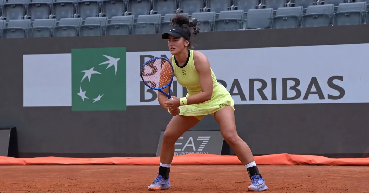 Bianca Andreescu in athletic ready stance during her 2026 Rome Masters match on the red clay courts at the Italian Open