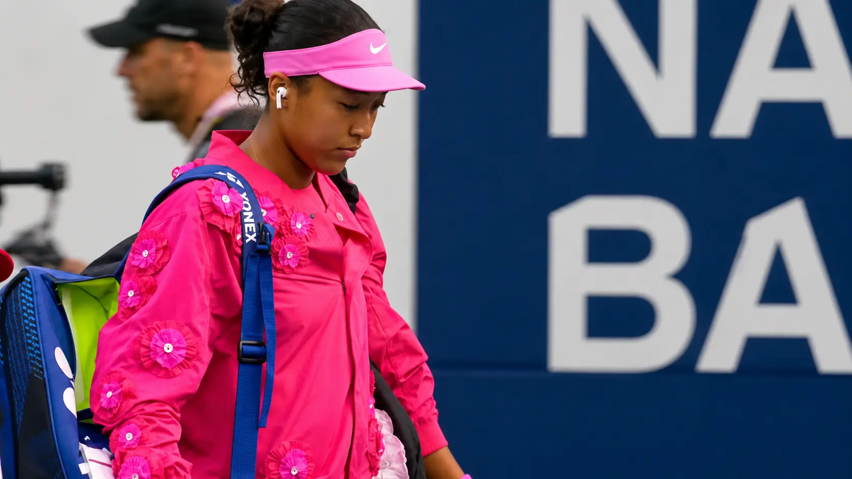 Naomi Osaka enters the Toronto arena ahead of her match at the Canadian Open