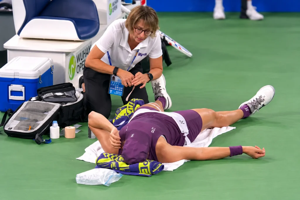 Iga Swiatek receives medical treatment during her 2026 Wuhan Open semifinal