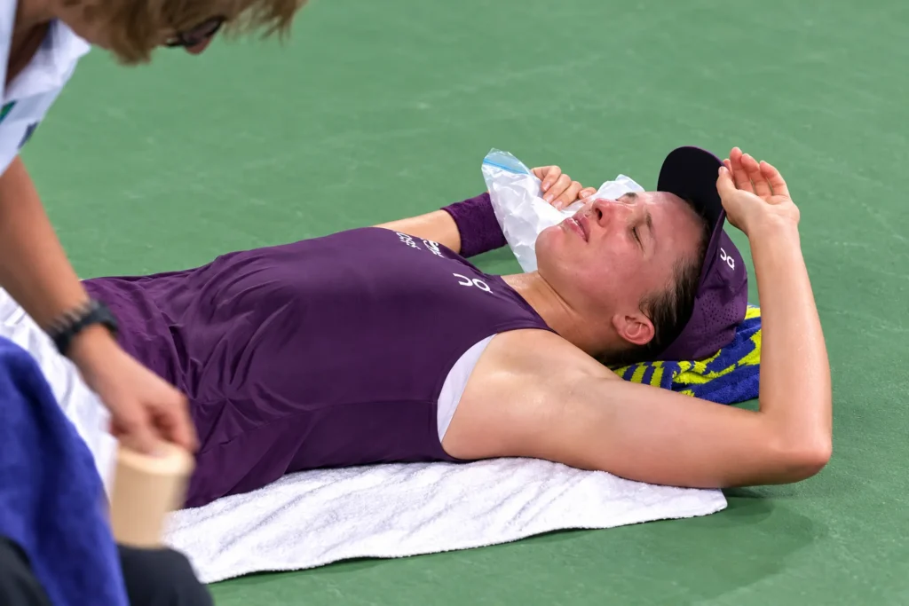 Iga Swiatek receives treatment after struggling physically during her 2026 Wuhan Open semifinal against Maja Chwalinska