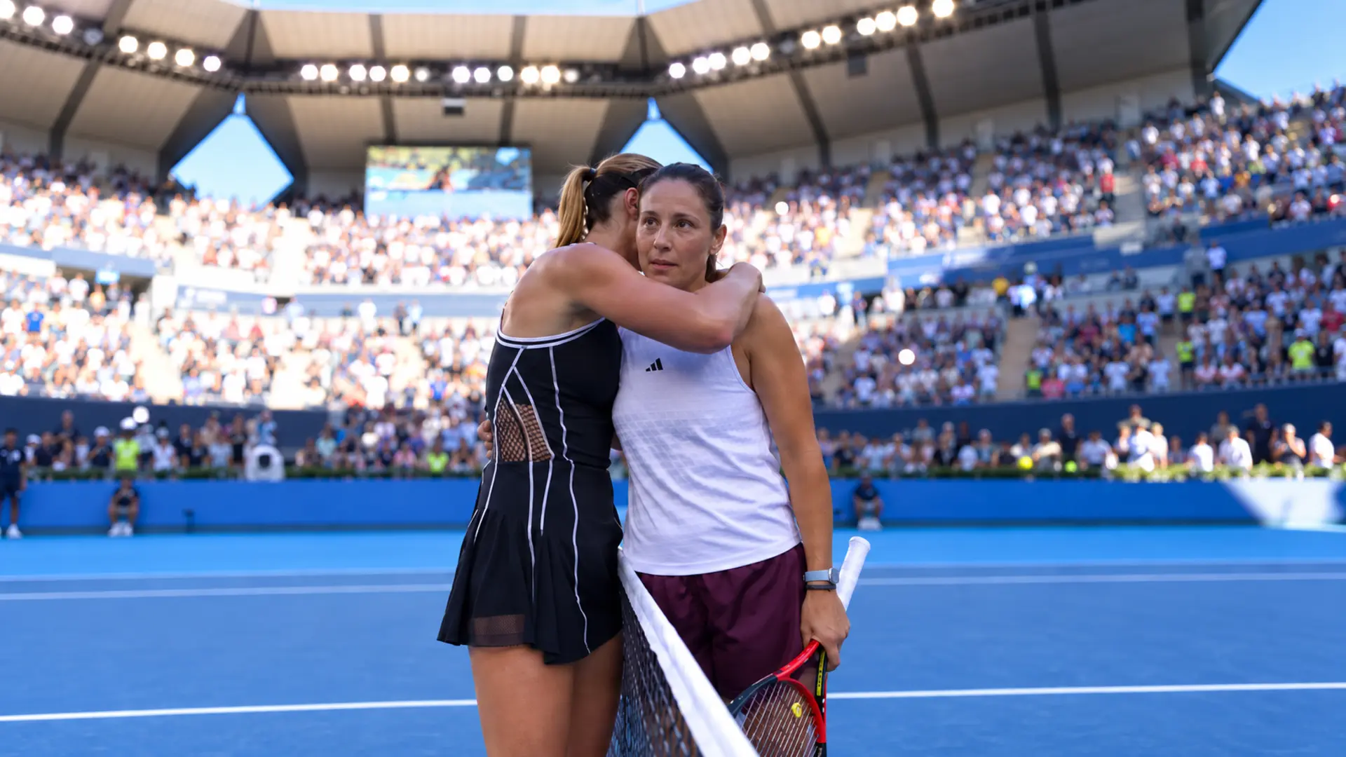 Paula Badosa comforts Daria Kasatkina after defeating her in the first round of the 2026 China Open